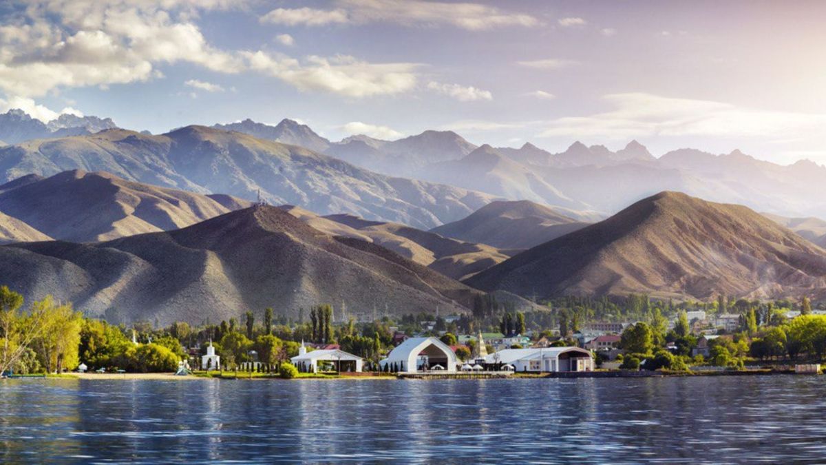 Yurt camp on the shore of Issyk-Kul below the mountains