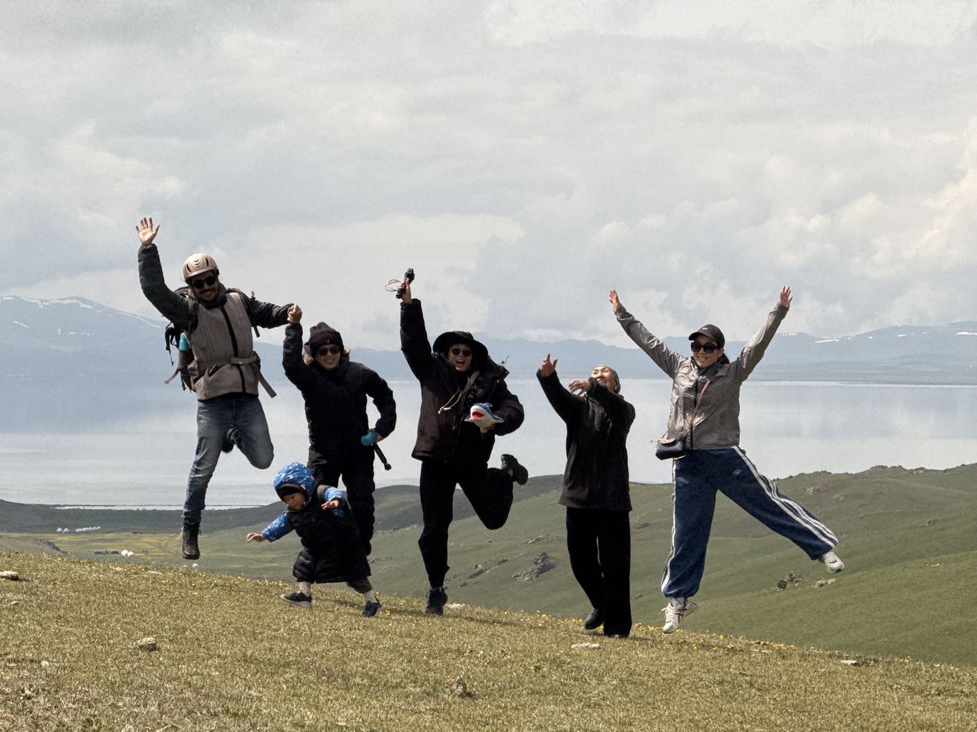 Guests jumping for joy above the lake