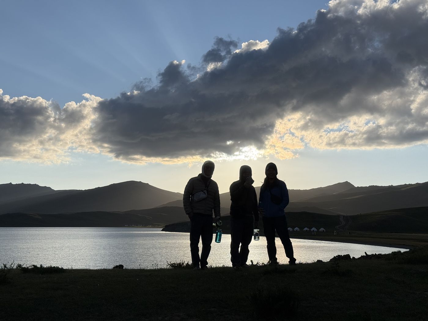 Guests by a lake at sunset