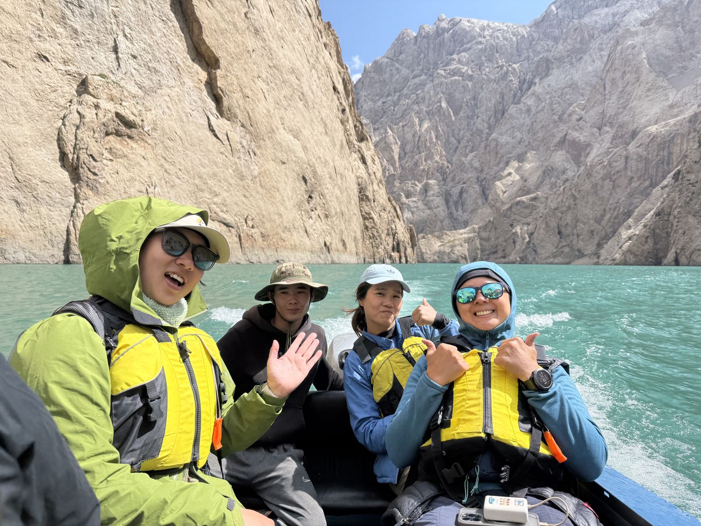 Guests on a boat in the Kel-Suu canyon