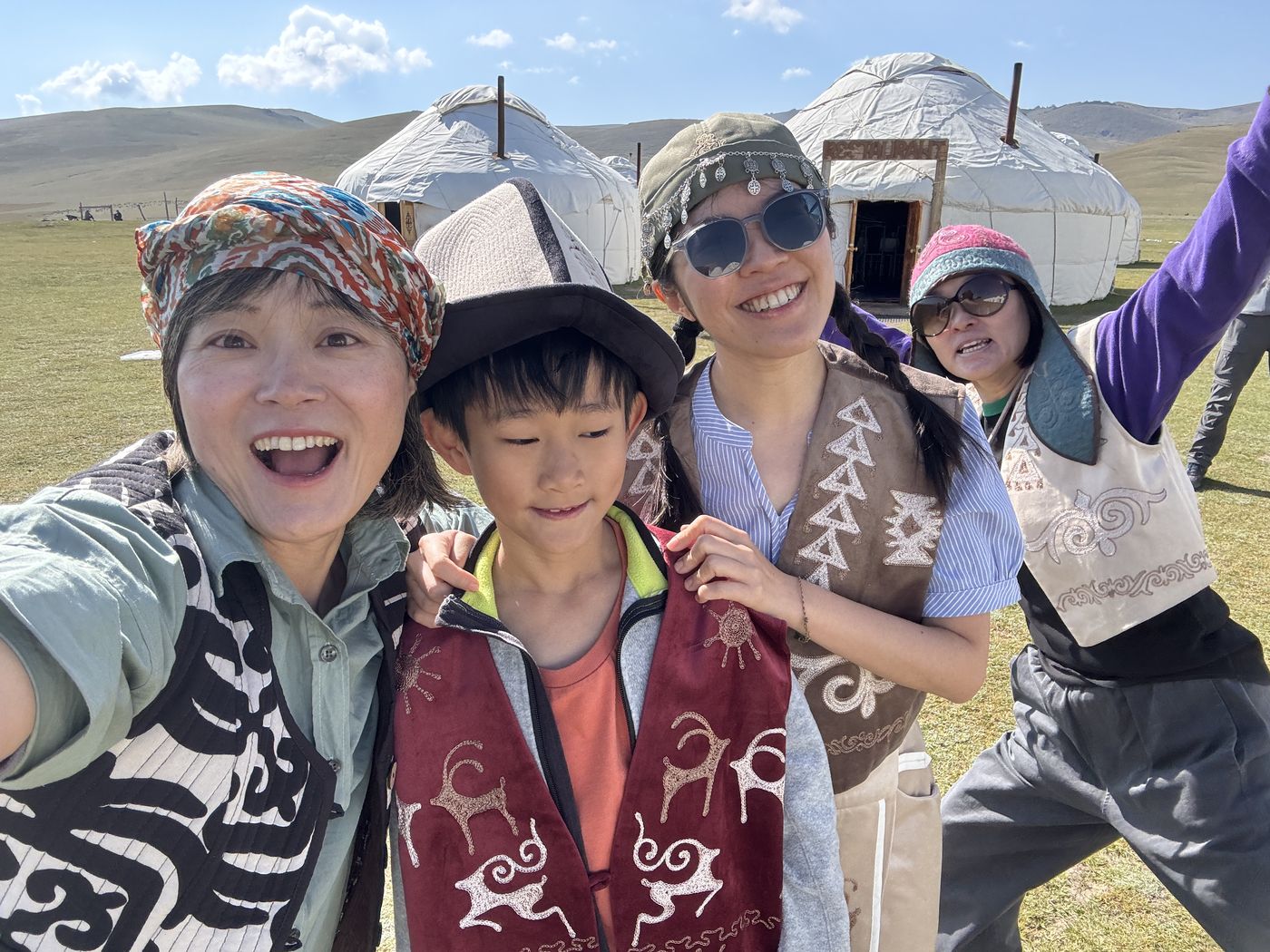 A selfie in traditional vests at the yurt camp
