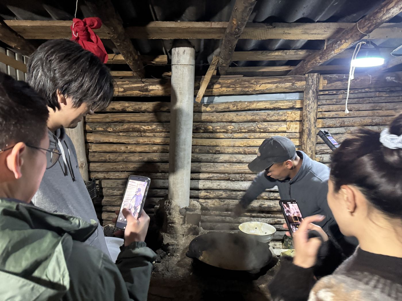 Watching dinner being cooked in a log kitchen